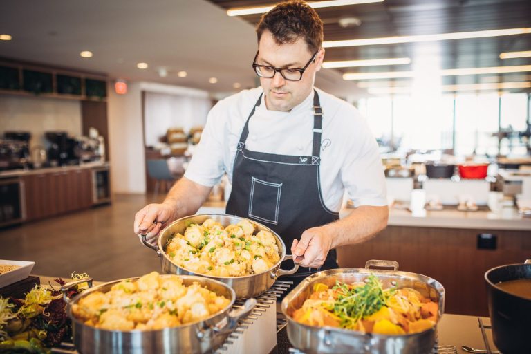 Wolfgang Puck Catering Staff Preparing Dishes for A Workplace